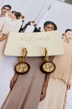 ALV Jewels EE Oval Drop Hoop Earrings — Brown, Gold-tone hoops, oval drops, brown surrounds, faceted champagne-tone centers, sold as a pair