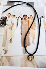 ALV Jewels EE Oval Cord Necklace — Brown, Dark cord, oval pendant, faceted champagne-tone center, brown surround, gold-tone accents