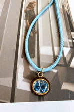 ALV Jewels EE Oval Cord Necklace — Blue, Blue cord, oval pendant, faceted blue center, brown surround, gold-tone accents