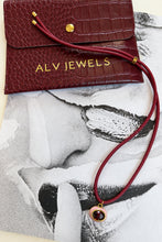 ALV Jewels EE Oval Cord Necklace — Pink, Burgundy cord, oval pendant, pink surround, faceted deep red center, gold-tone trim