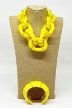 The Michelle Necklace in yellow with sculptural chain links and polished high-shine finish