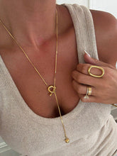 18k gold-plated Sadie Necklace paired with modern gold rings