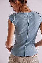 Tourmaline blue short sleeve tee by Free People with visible seamwork and high neckline