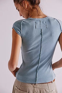 Tourmaline blue short sleeve tee by Free People with visible seamwork and high neckline