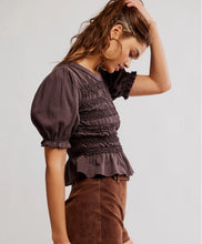brown Fitted smocked top featuring gathered bodice and short sleeves