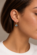 ALV Jewels EE Oval Drop Hoop Earrings — Blue, Gold-tone hoops, oval drops, faceted light blue centers, deep brown surrounds, sold as a pair