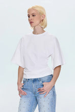 Shirttail hem white tee styled with denim
