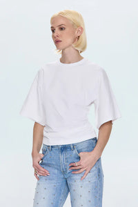 Shirttail hem white tee styled with denim