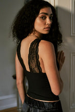 Back view of black lace strap cami with smooth stretch fabric