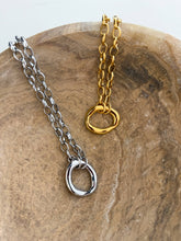 18k gold-plated necklace styled with neutral tank and gold watch