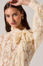Feminine floral lace blouse with long sleeves and vintage-inspired details