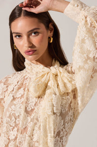Feminine floral lace blouse with long sleeves and vintage-inspired details