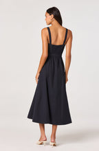 Back view of navy Mckinley midi dress showing godet skirt and full length