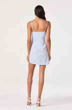 The ASTR the Label Blake Pleated Mini Dress in powder blue — structured boning, a rosette hip detail, and a dramatic cutaway pleated hem.