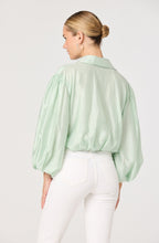 Back view of Cordey balloon sleeve top with elasticized hemline