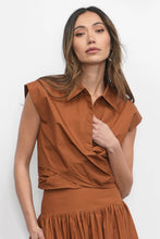 Sleeveless rust wrap front blouse with collared neckline