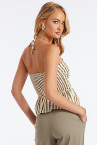 Peplum detail and subtle cut-out on a structured halter silhouette