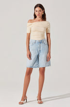 Fitted silhouette of the Saylah Twist Top by ASTR the Label paired with neutral heels