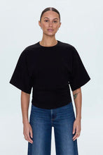 Fitted black tee with cinched sides and shirttail hem
