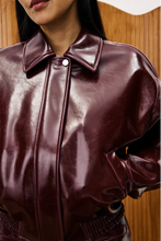 Close-up of the model wearing the Beauvoir Bomber