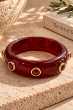 Burgundy Bead Accent Resin Cuff Bracelet with round metallic accents
