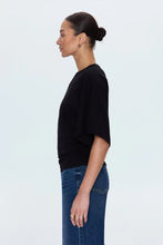 Side view of Pistola Veronica tee in compact black cotton