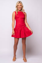 Red linen drop waist mini dress with boat neckline and flared skirt.