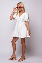 white puff sleeve mini dress with black stitching