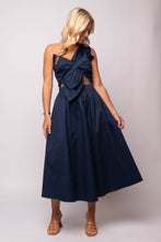  navy one-shoulder midi dress with twisted bow, front cut-out, and A-line skirt. 
