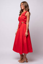 Red midi dress with asymmetric neckline, oversized bow detail