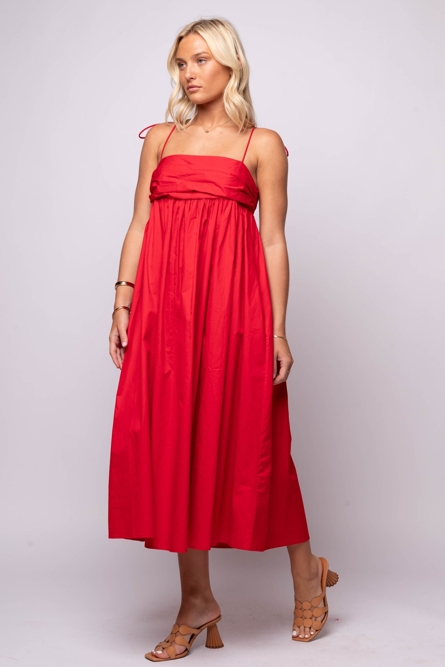  red cotton poplin dress, with sweetheart neckline and full midi skirt.