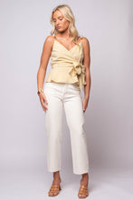 Peplum Top by En Saison with waist tie, peplum hem, and beaded shoulder straps in light yellow