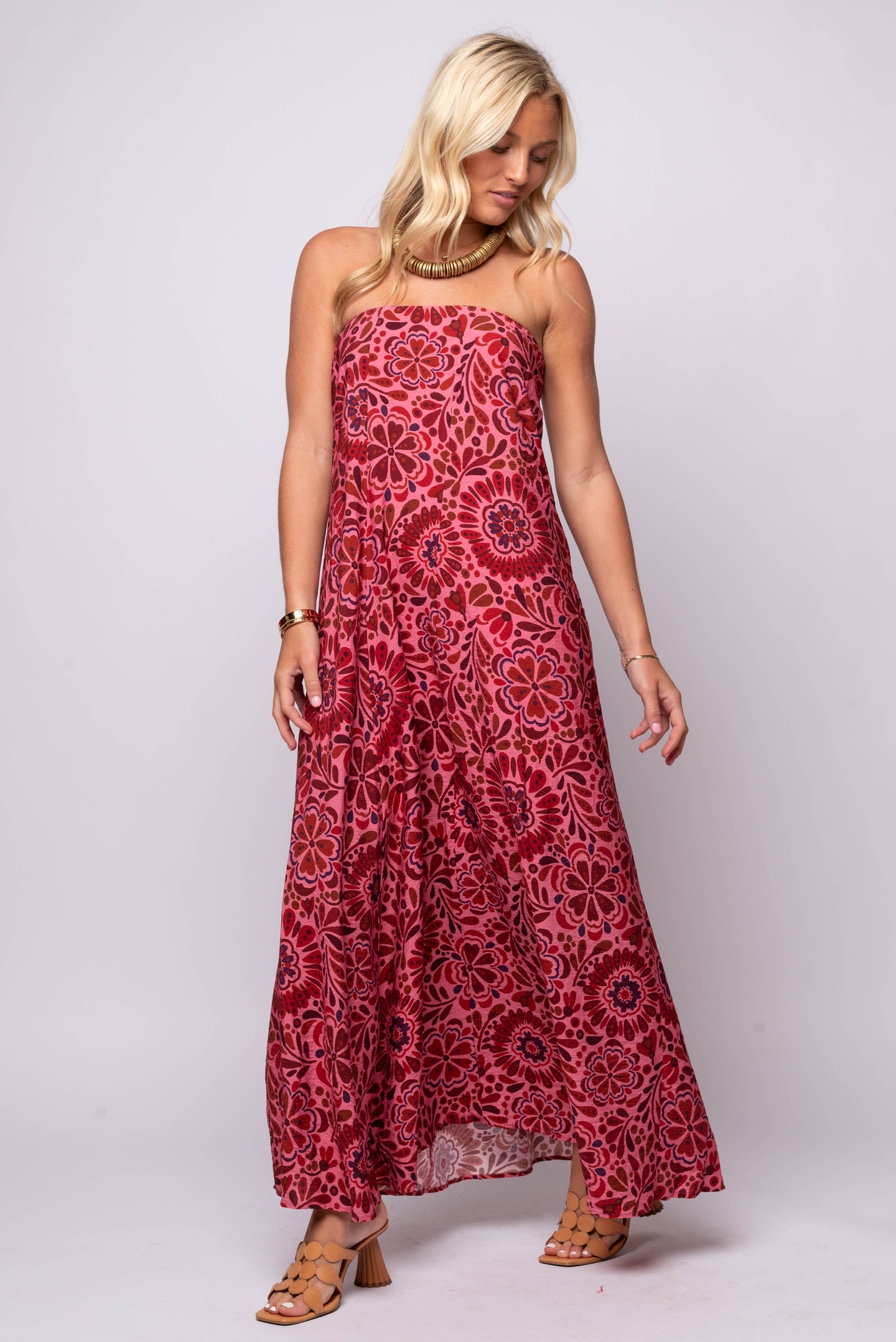 Strapless red and pink floral maxi dress with flowy silhouette and bohemian print