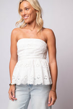 White strapless eyelet peplum top with scalloped hem and smocked back