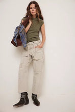 Fitted olive tee with crew neckline and raw seams in a soft, ribbed cotton fabric.