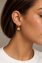 ALV Jewels EE Oval Drop Hoop Earrings — Brown, Gold-tone hoops, oval drops, brown surrounds, faceted champagne-tone centers, sold as a pair