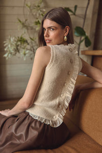 Sleeveless cream cable knit sweater tank with ruffle back and pearl buttons by ASTR