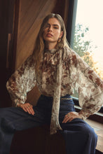 Sheer floral balloon sleeve blouse with bow tie neckline by ASTR