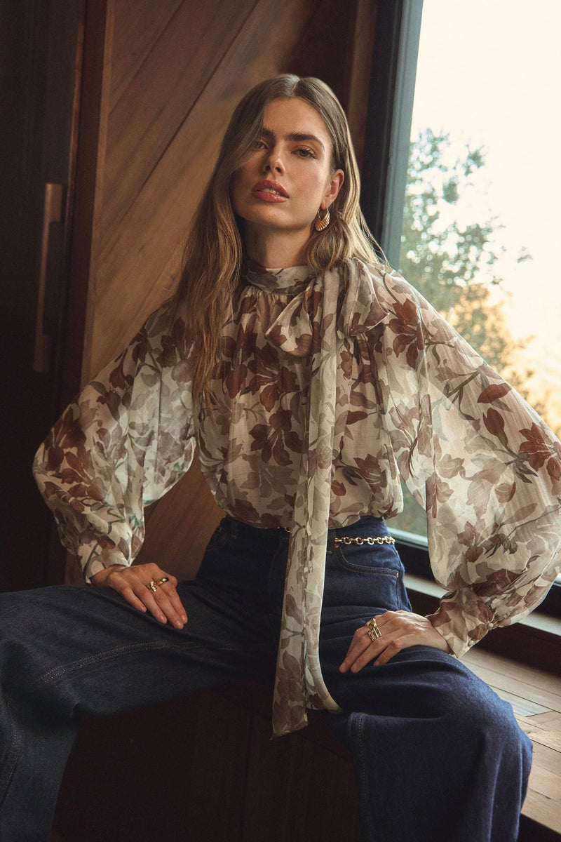 Sheer floral balloon sleeve blouse with bow tie neckline by ASTR