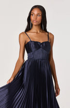 Navy pleated dress with sweetheart neckline and smocked back panel