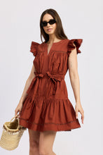 Emma Mini Dress with ruffle sleeves and bow details in warm brick red