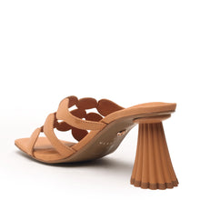 Sculptural flared heel and square toe design in a neutral leather finish