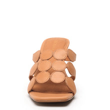 Bold leather slide with modern cutouts and wide-set heel silhouette