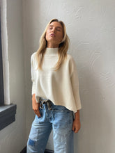 Cream Aja Sweater with a mock neck and wide sleeves