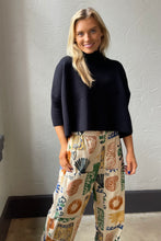 Navy Aja Sweater with a mock neck and wide sleeves
