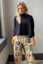 Navy Aja Sweater with a mock neck and wide sleeves