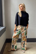 Navy Aja Sweater with a mock neck and wide sleeves