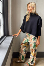 Navy Aja Sweater with a mock neck and wide sleeves