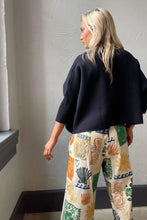 Navy Aja Sweater with a mock neck and wide sleeves