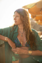 Lifestyle shot – Anabel Aram Milos Hinged Bangle styled on model outdoors